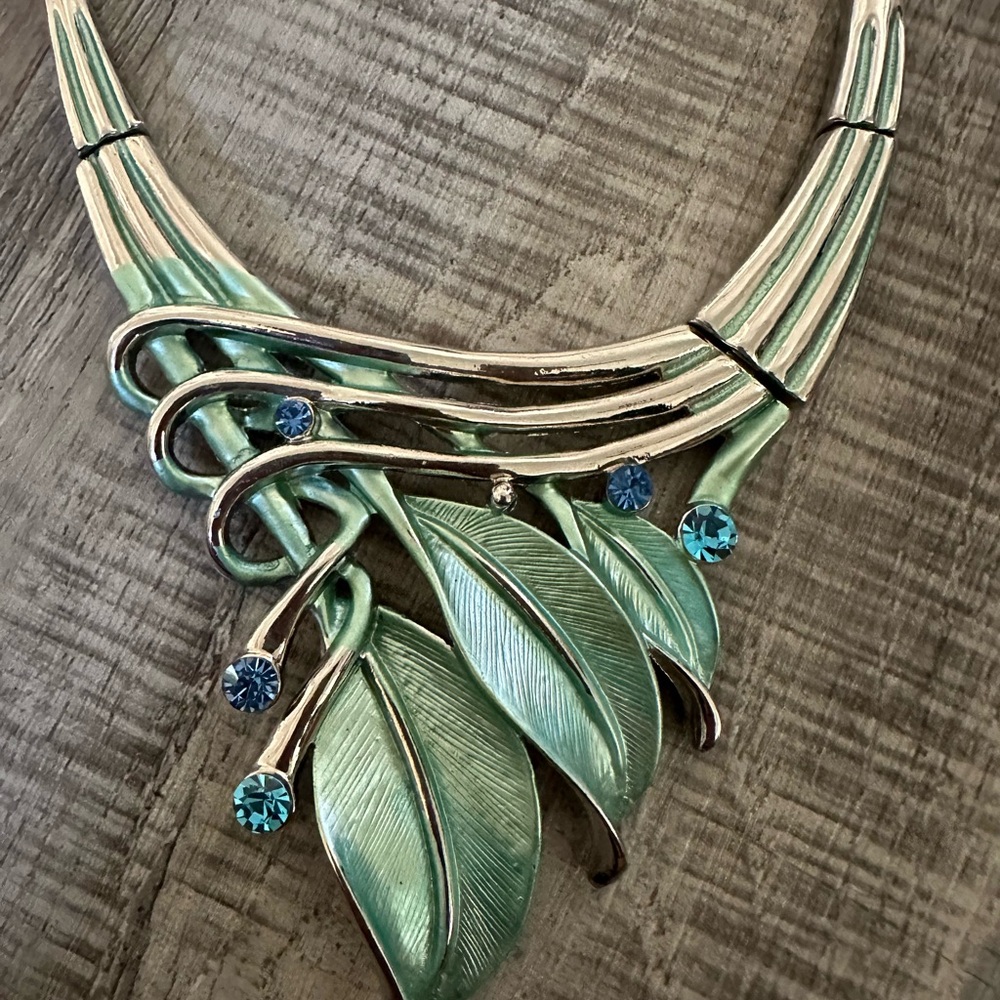 Silver tone statement necklace with matching earrings and rhinestones